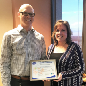 FBG Service Corp's Terri Gogetap presents the 
GREENGUARD certificate to Tim Malik of First National Bank Omaha. 
